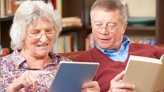 A couple looking at a tablet computer